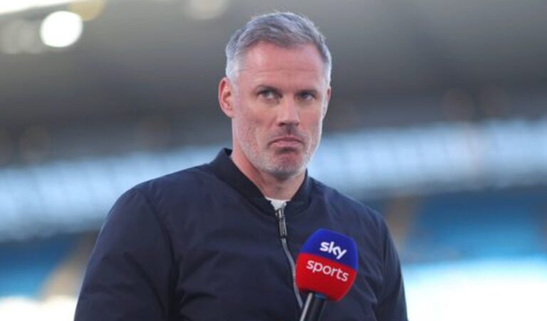 Jamie Carragher with a Sky Sports microphone
