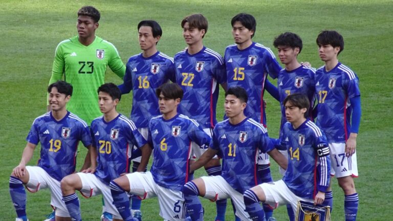 Japan national football team line up for a team photo in 2024