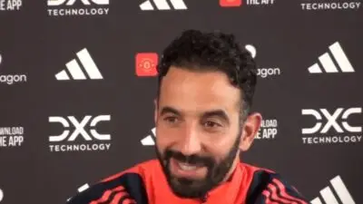 Man Utd manager Ruben Amorim smiling at a press conference