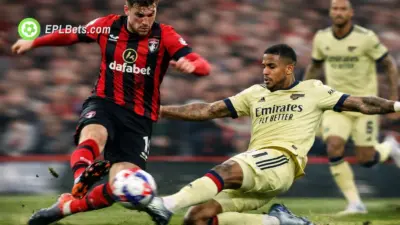 Arsenal defender Gabriel slides in to tackle a Bournemouth player