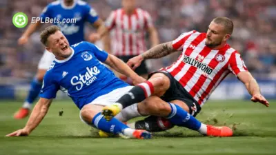 An Everton and Brentford player contest a sliding tackle in an EPL match