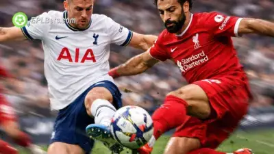 Tottenham and Liverpool players compete for a loose ball