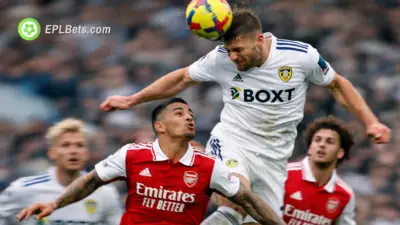 A Leeds United player leaps to head clear against Arsenal