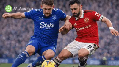 James Tarkowski and Bruno Fernandes compete for the ball