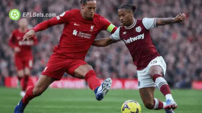 Virgil van Dijk and Crysencio Summerville compete for the ball