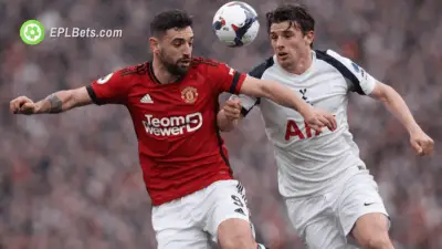 Bruno Fernandes and Conor Gallagher challenge for the ball