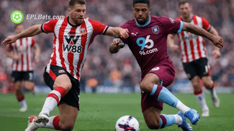 Sunderland and Burnley players battle for the ball in a sliding tackle