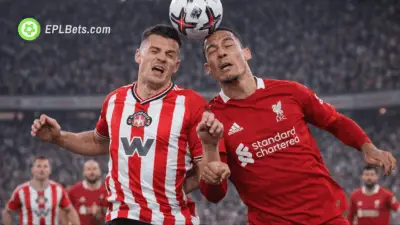 Sunderland and Liverpool players challenge for the ball