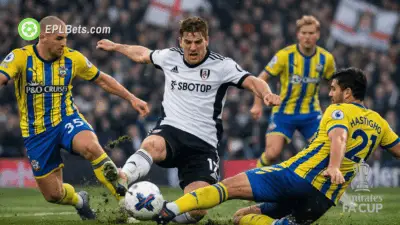 Fulham and Southampton players go into a tackle