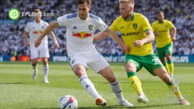 Leeds United and Norwich City players compete for the ball