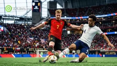 Tyler Adams slides in to tackle Kevin de Bruyne as the USMNT face Belgium