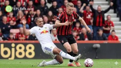 Noah Okafor of Leeds tackles Bournemouth's Adrien Truffert