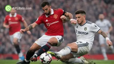 Bruno Fernandes and Ethan Ampadu contest a tackle