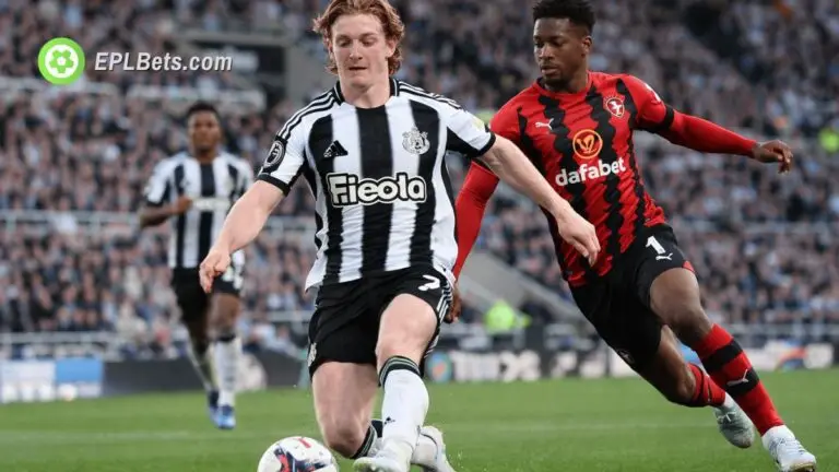 Anthony Gordon protects the ball from a Bournemouth player