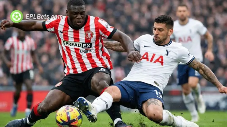 Brian Brobbey is tackled by Christian Romero