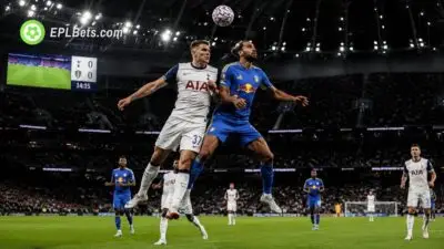 Dominic Calvert-Lewin challenges Mickey van de Ven for a header