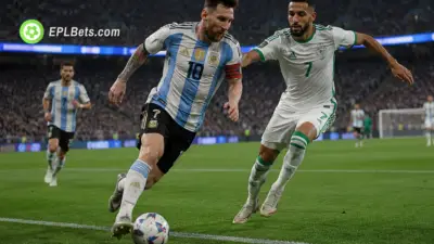 Lionel Messi of Argentina taking on Riyad Mahrez of Algeria in a World Cup clash