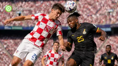 Luka Vušković of Croatia challenging in the air with Antoine Semenyo of Ghana as both teams hope for a spot in the last 32