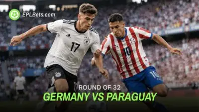 Germany and Paraguay players jostle for the football