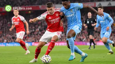 Christos Tzolis of Arsenal, jostling for the ball with Amenda of Coventry City