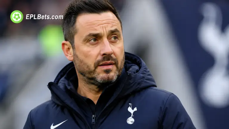 Tottenham Hotspur manager Roberto De Zerbi standing pitchside