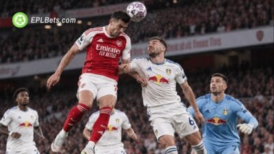 Arsenal and Leeds players contest an aerial ball during their Premier League clash at the Emirates Stadium.