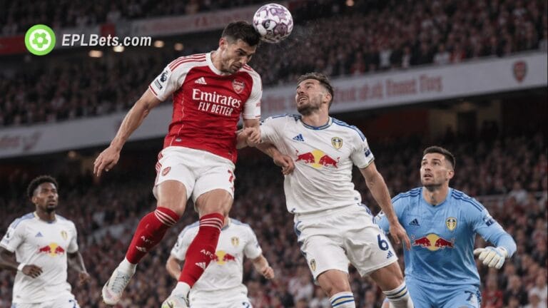 Arsenal and Leeds players contest an aerial ball during their Premier League clash at the Emirates Stadium.