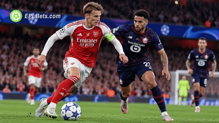 Arsenal captain Martin Ødegaard dribbles past a Lille player during a UEFA Champions League clash at the Emirates Stadium.
