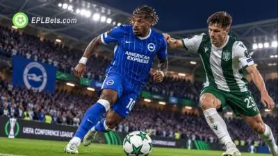 Brighton player in the club's blue pinstriped home kit battles for possession against a Kauno Žalgiris defender during a UEFA Conference League match illustration.