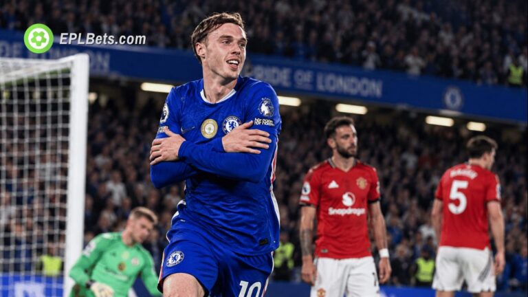 Chelsea midfielder Cole Palmer celebrates a goal with his trademark crossed-arms celebration as Manchester United players look dejected at Stamford Bridge.