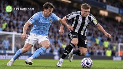 Newcastle United winger Harvey Barnes dribbles past a Coventry City player during a Premier League clash at the Coventry Building Society Arena.