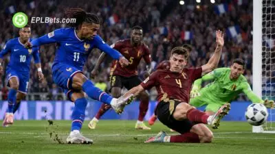 France attacker fires a shot at goal as a Belgium defender slides in to block during their UEFA Nations League clash in Paris.