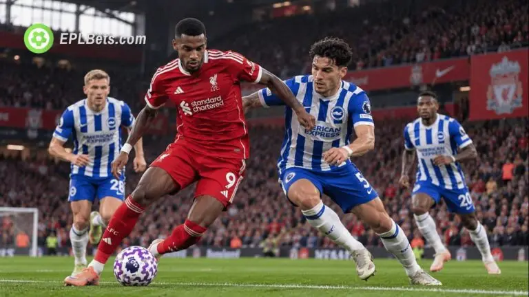 Liverpool striker Alexander Isak dribbles the ball while being challenged by a Brighton defender during a Premier League match at Anfield.