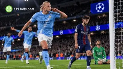 Erling Haaland celebrates a goal for Manchester City as a PSG player looks dejected during a Champions League match illustration.
