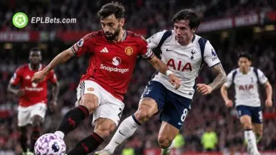 Bruno Fernandes battles Sandro Tonali for possession during Manchester United's Premier League clash with Tottenham at Old Trafford.