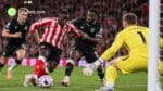 Sunderland striker Brian Brobbey attempts to break through the Brentford defence as the goalkeeper closes him down during a Carabao Cup clash at the Stadium of Light.