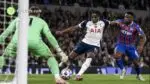 Tottenham attacker prepares to shoot at goal under pressure from a Crystal Palace defender during a Premier League clash at the Tottenham Hotspur Stadium.